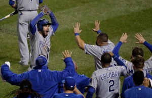 Kansas City Royals first baseman Eric Hosmer celebrates with his teammates after scoring during the ninth inning of Game 5 of the Major League Baseball World Series against the New York Mets Sunday, Nov. 1, 2015, in New York. (AP Photo/Julie Jacobson)